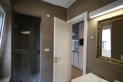 a bathroom with a mirror and a sink at Status-M Apartments Franca sea view in Budva