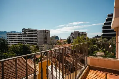 a balcony with a view of a city at Harmony Budva Apartment in Budva
