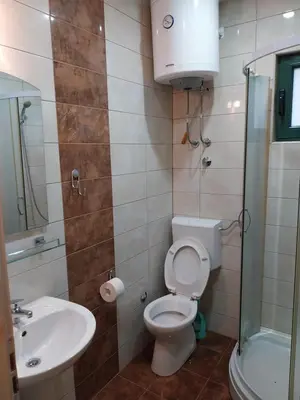 a bathroom with a toilet and a sink at Apartmani Jaz 24 in Budva