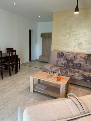 a living room with a couch and a table at Apartmani Jaz 24 in Budva