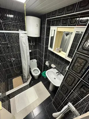 a bathroom with a sink and a toilet and a mirror at Budva App4 in Budva