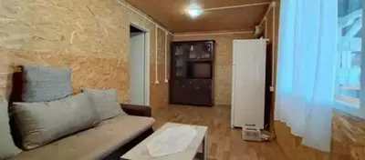 a living room with a couch and a coffee table at Kucica Truma in Ulcinj