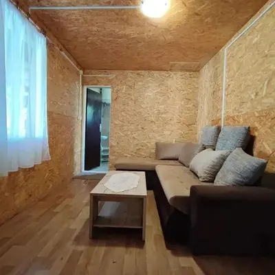 a living room with a couch and a table at Kucica Truma in Ulcinj