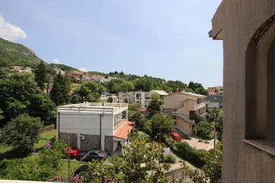 a view of a city from a building at Magnolia rooms and apartments in Sutomore