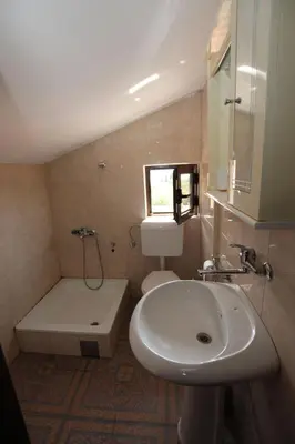 a bathroom with a sink and a toilet and a tub at Magnolia rooms and apartments in Sutomore