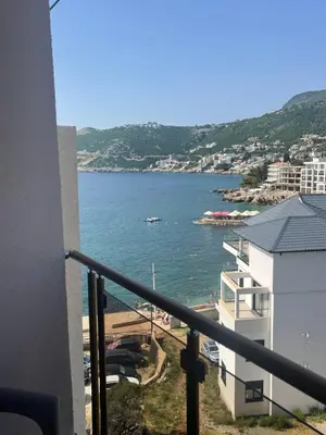 a view of the ocean from a balcony of a building at PETROVIĆ in Bar