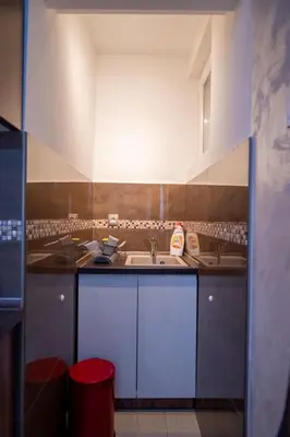 a kitchen with a sink and a counter top at Apartman Milica-Mica in Kotor