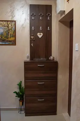 a dresser in a room with a chest of drawers at Apartman Milica-Mica in Kotor