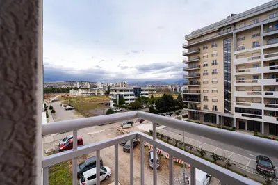 a balcony with a view of a parking lot at Spacious two bedroom in Podgorica