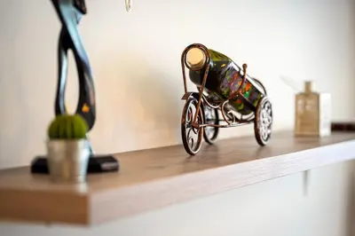 a small toy car is sitting on a shelf at Spacious two bedroom in Podgorica