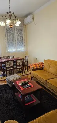 a living room with a couch and a table at Plaza Centar Podgorica in Podgorica