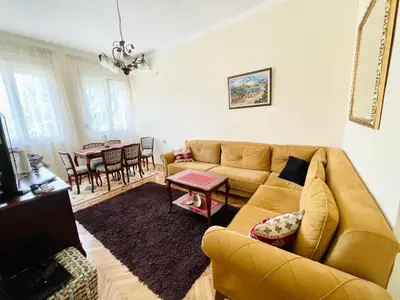 a living room with a couch and a table at Plaza Centar Podgorica in Podgorica