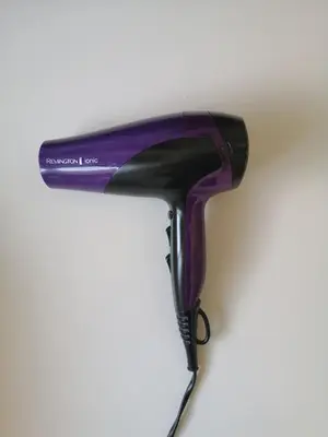 a hair dryer sitting on top of a table at One-Bedroom Apartment in the Center of Budva on a Quiet Street 5 Minutes to the Beach in Budva