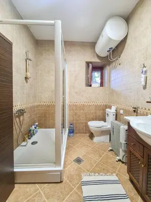 a bathroom with a shower and a toilet at Lovćen Escape, Rustric House in Cetinje
