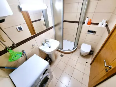 a small bathroom with a sink and a toilet at Renta Stanovi Podgorica in Podgorica