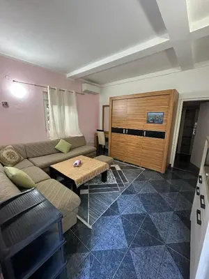 a living room with a couch and a table at Stone Villa Guesthouse in Budva