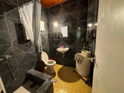 a bathroom with a toilet and a sink at Stone Villa Guesthouse in Budva