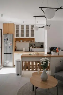 a kitchen with a vase of flowers on a table at Nest 382 in Kotor