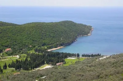 an aerial view of a body of water with trees at PRINCESS - Valdanos in Ulcinj