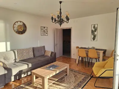 a living room with a couch and a table at Rudovic Apartments in Ulcinj