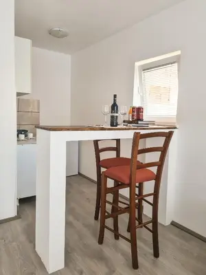 a kitchen with a table and two chairs at Lemon&Olives in Budva