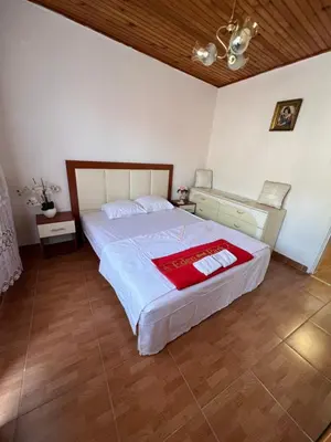 a bedroom with a large bed in a room at City Heart Apartments 2 in Ulcinj