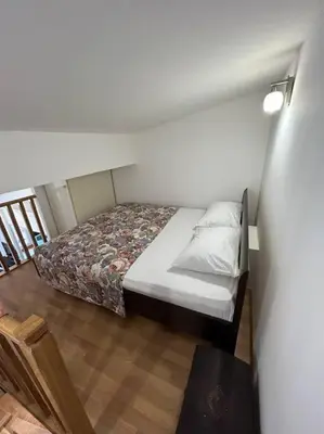 a small bedroom with a bed in a room at Stylish_apartment in Podgorica