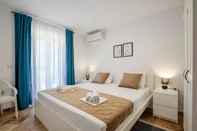 a bedroom with a bed with two towels on it at Vacation home in Budva with fantastic oceanview in Krimovice