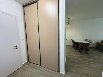 a sliding glass door in a room with a table at K apartments in Becici