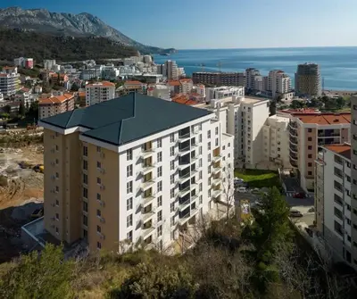 an aerial view of a city with buildings and the ocean at K apartments in Becici