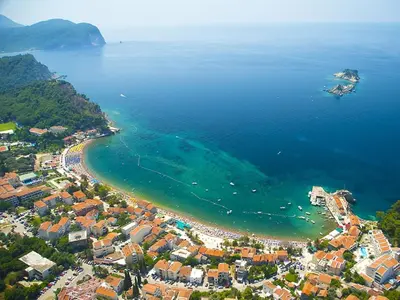 an aerial view of a beach and the ocean at Apartments Djuro in Petrovac na Moru