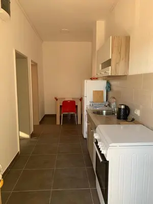a kitchen with a sink and a counter top at Mariyka Apartaments 2 in Sutomore