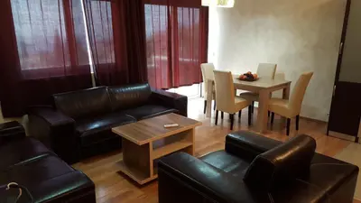 a living room with a couch and a table at Holiday Home Kalicanin in Bar