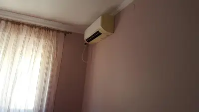 a television on the corner of a room with a window at Holiday Home Kalicanin in Bar