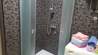 a bathroom with a shower with a toilet and a sink at Holiday Home Kalicanin in Bar