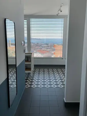 a bathroom with a large window and a tile floor at MiU Bar Apartment in Donji Susanj