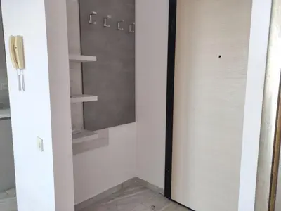 a glass door of a closet with shelves at Hillside Apartment with Infinity Pool and Sea View in Budva