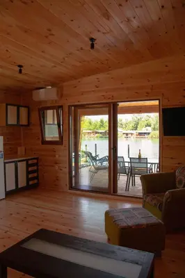 a living room with a large sliding glass door at River house Bonaca in Ulcinj