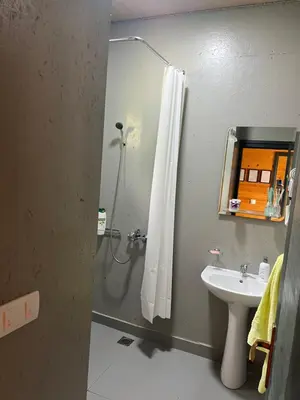 a bathroom with a shower and a sink at Barbana Cottage , Ada Bojana in Ulcinj