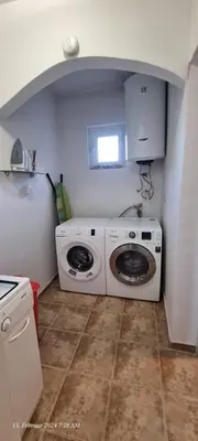 a washer and dryer in a small kitchen at Schmidt in Lastva