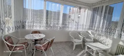 a room with chairs and tables and a window at Schmidt in Lastva