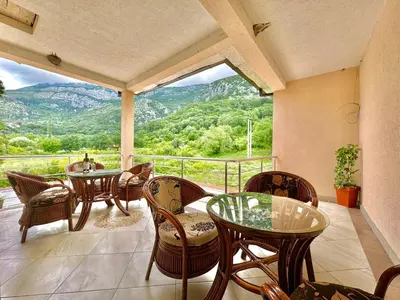 a balcony with tables and chairs and a view at STARS RESIDENCE in Petrovac na Moru