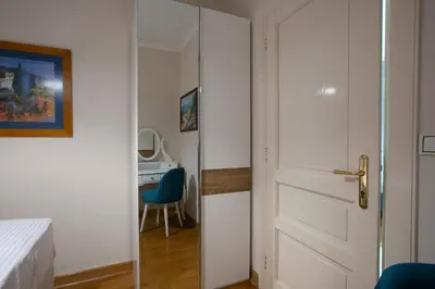 a door leading into a room with a desk at Luxury Apartments Montesan in Sveti Stefan
