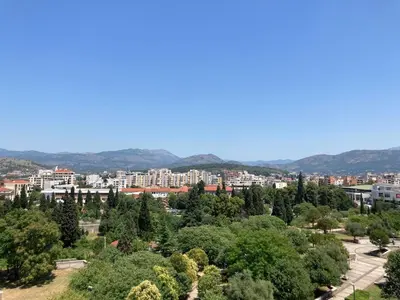 a view of a city with trees and buildings at City View Studio in Podgorica