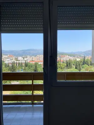 an open door with a view of a city at City View Studio in Podgorica