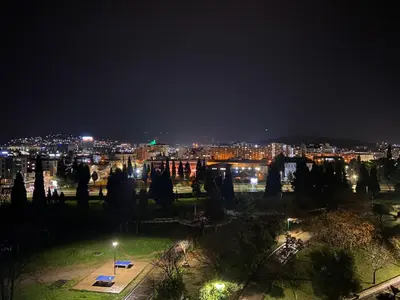 a view of a city at night with lights at City View Studio in Podgorica
