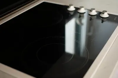a row of knobs on a stove top oven at Guest House Medin in Petrovac na Moru