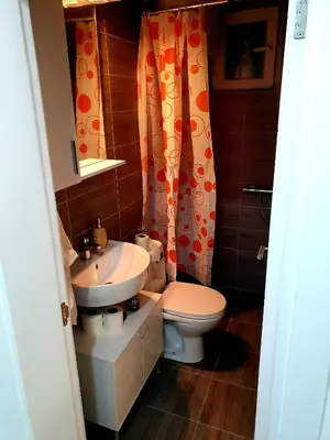 a bathroom with a toilet and a sink at D&D in Bar