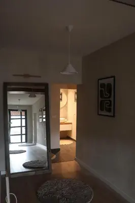 a living room with a mirror on the wall at Casa L in Ulcinj