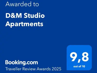 a blue sign with the text emailed to dm studio apartments at D&M Studio Apartments in Bar
